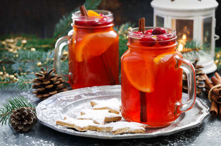 Christmas hot cranberry and orange tea and cookiesの写真素材