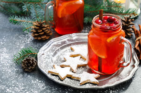 Christmas hot cranberry and orange tea and cookiesの写真素材