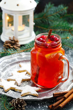 Christmas hot cranberry and orange tea and cookiesの写真素材