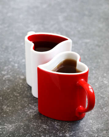 Two heart shaped cups with teaの写真素材