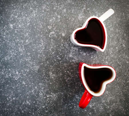 Two heart shaped cups with teaの写真素材
