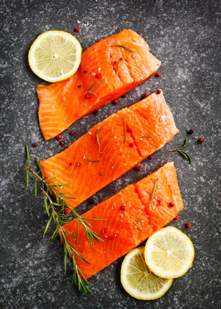 Fresh salmon fillet with herbs and spicesの写真素材