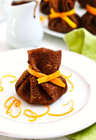 Chocolate pancakes with orange and chocolate
の写真素材