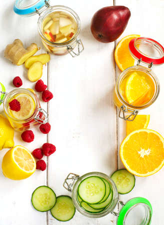 Healthy Spa Water with Fruit and vegetable. Cucumber, orange, lemon and raspberry, pear and ginger spa water.の写真素材
