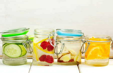 Healthy Spa Water with Fruit and vegetable. Cucumber spa water, pear and ginger spa water, lemon and raspberry spa water, and orange spa waterの写真素材