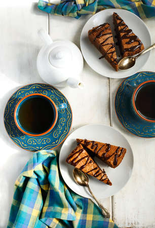 Chocolate cake and cup of tea, top viewの写真素材