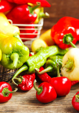 Variety of fresh organic peppers: Cherry hot red peppers, long red and green peppers, sweet banana peppers, sweet cubanelle peppers, sweet red sheppard peppers and hungarian peppers.の写真素材
