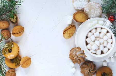 Cup of hot chocolate and assorted cookies: linzer cookies,shortbread, nuts cookie, orange almond cookie.の写真素材