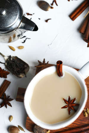 Traditional indian masala chai tea with spices in cup, top viewの写真素材