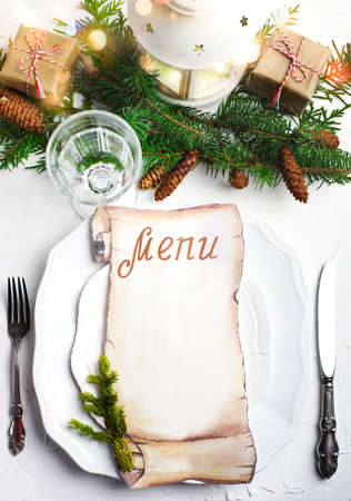 Christmas place setting with blank paper for writing the Christmas menu, top view, copy spaceの写真素材