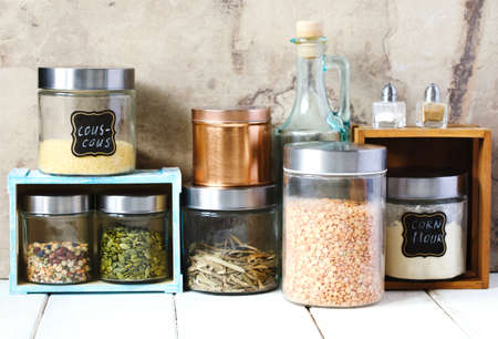 Arrangement of dry food products and kitchen utensils in the kitchenの写真素材