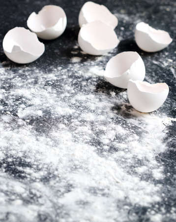 Flour and egg shels, baking background, copy space, selective focusの写真素材