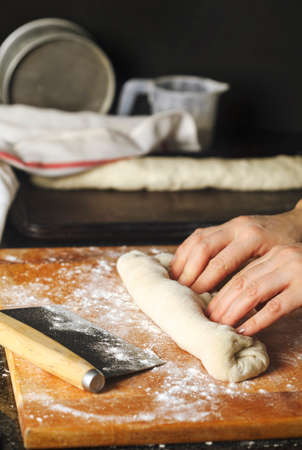 Woman preparing dough for french baguetteの写真素材
