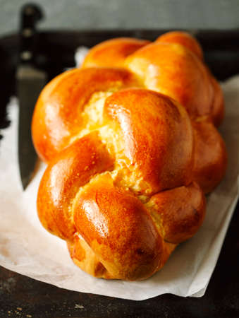 Freshly baked sweet braided bread loaf.  Challah bread