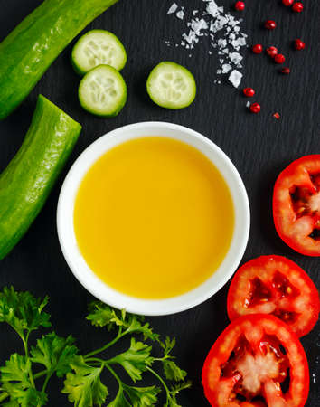 Olive oil, fresh vegetables, herbs and spicesの写真素材