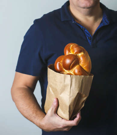 Sweet Challah bread in handの写真素材