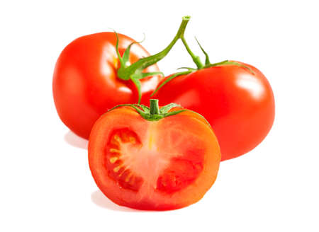 Fresh Tomatoes. Whole and a half isolated on white backgroundの写真素材