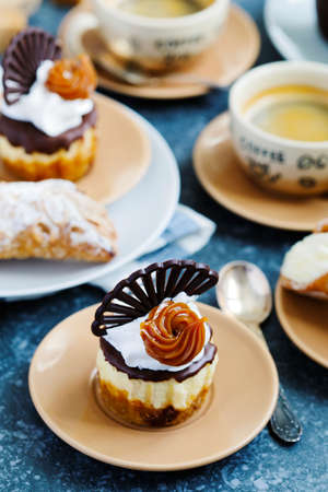 Mini cheesecake and cup of coffeeの写真素材