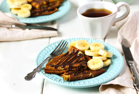 Crepes with banana and chocolate sauceの写真素材