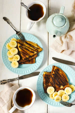 Crepes with banana and chocolate sauce top viewの写真素材