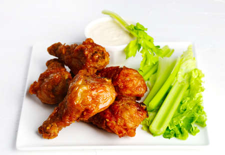 Fried chicken drumsticks and vegetablesの写真素材