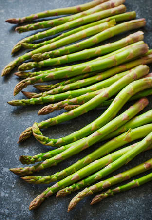 Fresh  raw asparagus on stone background.の写真素材