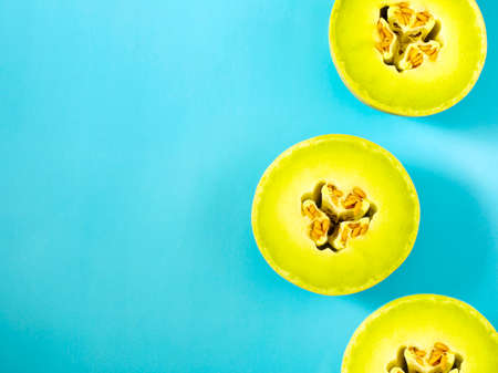 Honeydew Melon Against a Light Blue Background, copy spaceの写真素材