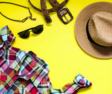 Woman fashion flatlay on yellow background. Top view, flat lay.の写真素材