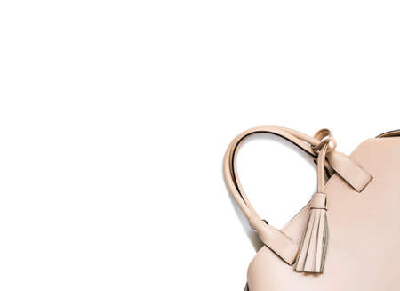 Beige woman's handbag isolated on white backgroundの写真素材
