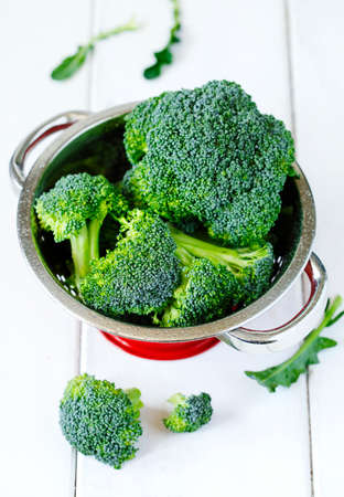 Fresh broccoli in colanderの写真素材