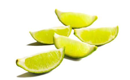 Fresh limes slices isolated on white background