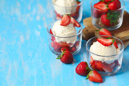 French vanilla ice cream with fresh strawberries, copy space
