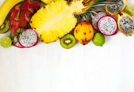 Assortment of exotic fruits on white background with copy spaceの写真素材