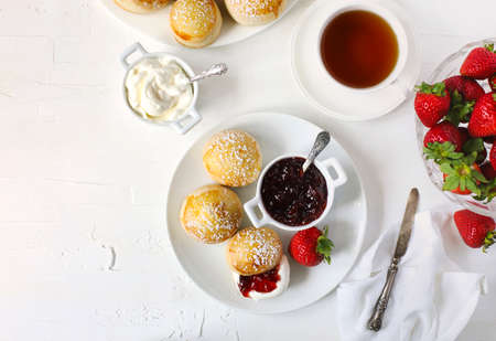 English scones with jam and whipped cream, top viewの写真素材