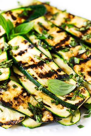 Grilled zucchini with basil and olive oil.の写真素材