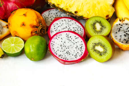 Assortment of exotic fruits on white background with copy space