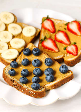 Nut butter and fruits vegan toastsの写真素材