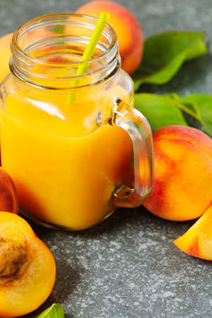 Peach juice in glass cupの写真素材