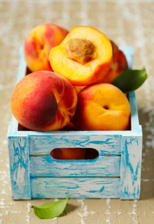 Ripe peaches in wooden boxの写真素材