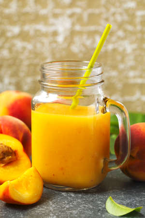 Peach juice in glass cupの写真素材