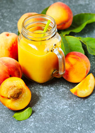 Peach juice in glass cupの写真素材