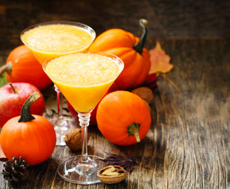 Pumpkin alcohol cocktail for fall and halloween partiesの写真素材