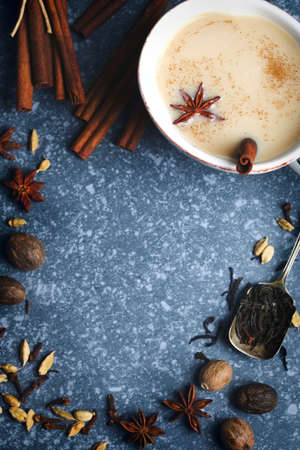 Traditional indian masala chai tea with spices, frame, copy spaceの写真素材