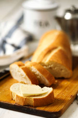 Butter on a fresh crunchy bread.の写真素材