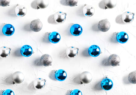 Christmas flat lay with blue abd silver glass balls, copy space on white backgroundの写真素材