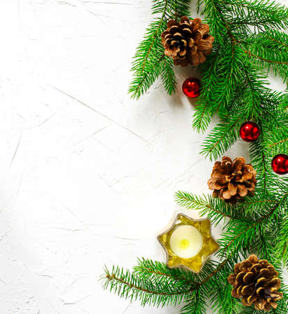 Christmas holiday background with fir branches, pine cones and ornaments. Winter holiday conceptの写真素材