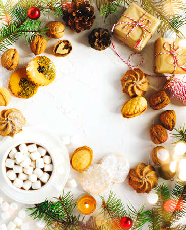 Cup of hot chocolate and assorted cookies: linzer cookies,shortbread, nuts cookie, orange almond cookie. Christmas concept, top view, copy spaceの写真素材