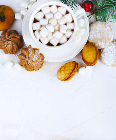 Cup of hot chocolate and assorted cookies: linzer cookies, shortbread, nuts cookie, orange almond cookie.の写真素材
