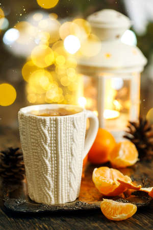Mug with hot tea, Christmas backgroundの写真素材