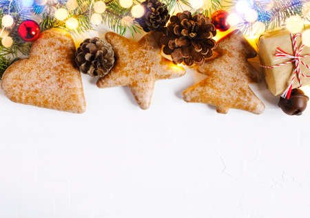 Christmas background with gingerbread, fir tree and holiday decoration, copy spaceの写真素材